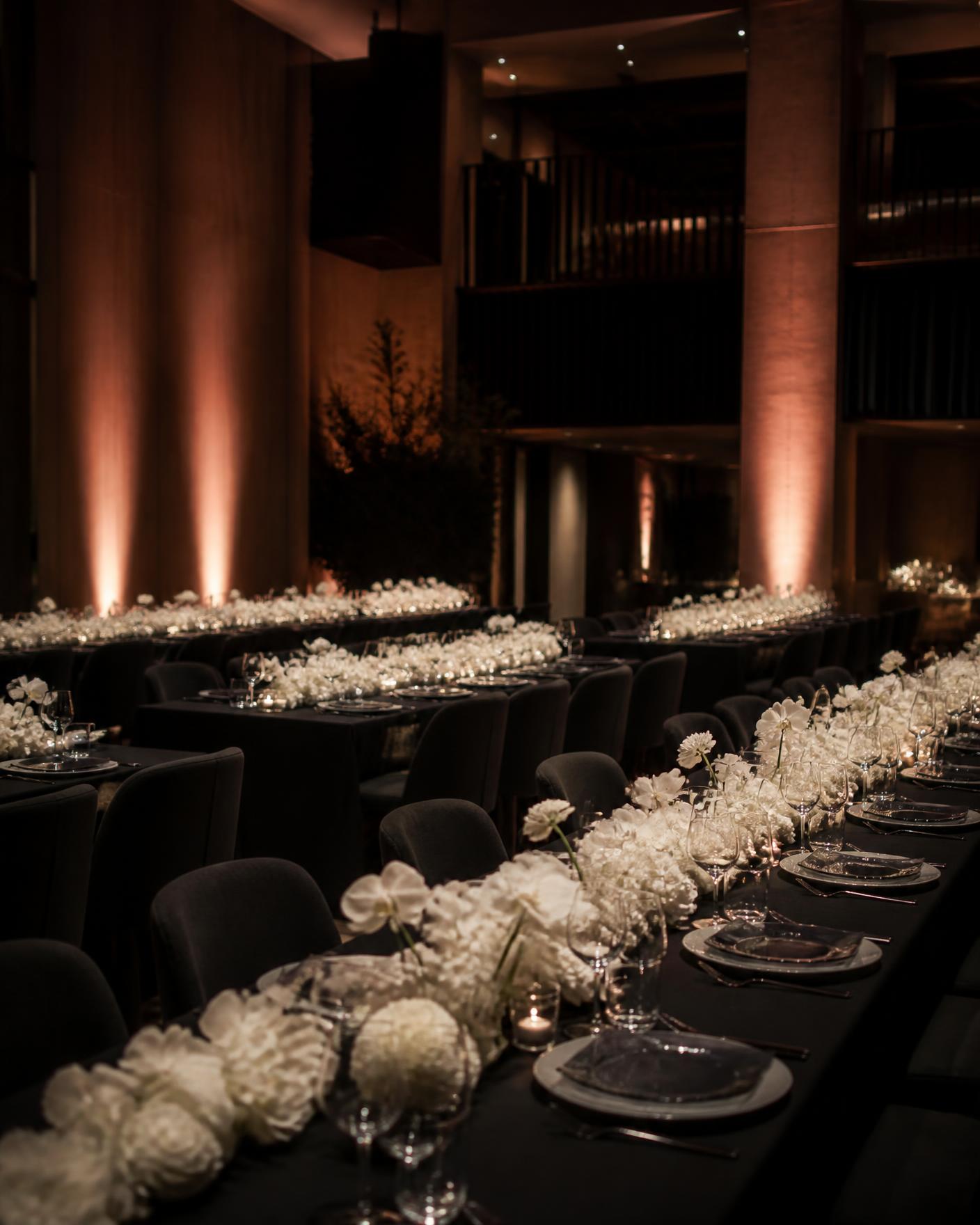 Dark dining room with white floral runners